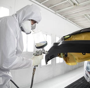 Collision Center Technician Painting a Vehicle | Bighorn Toyota in Glenwood Springs CO